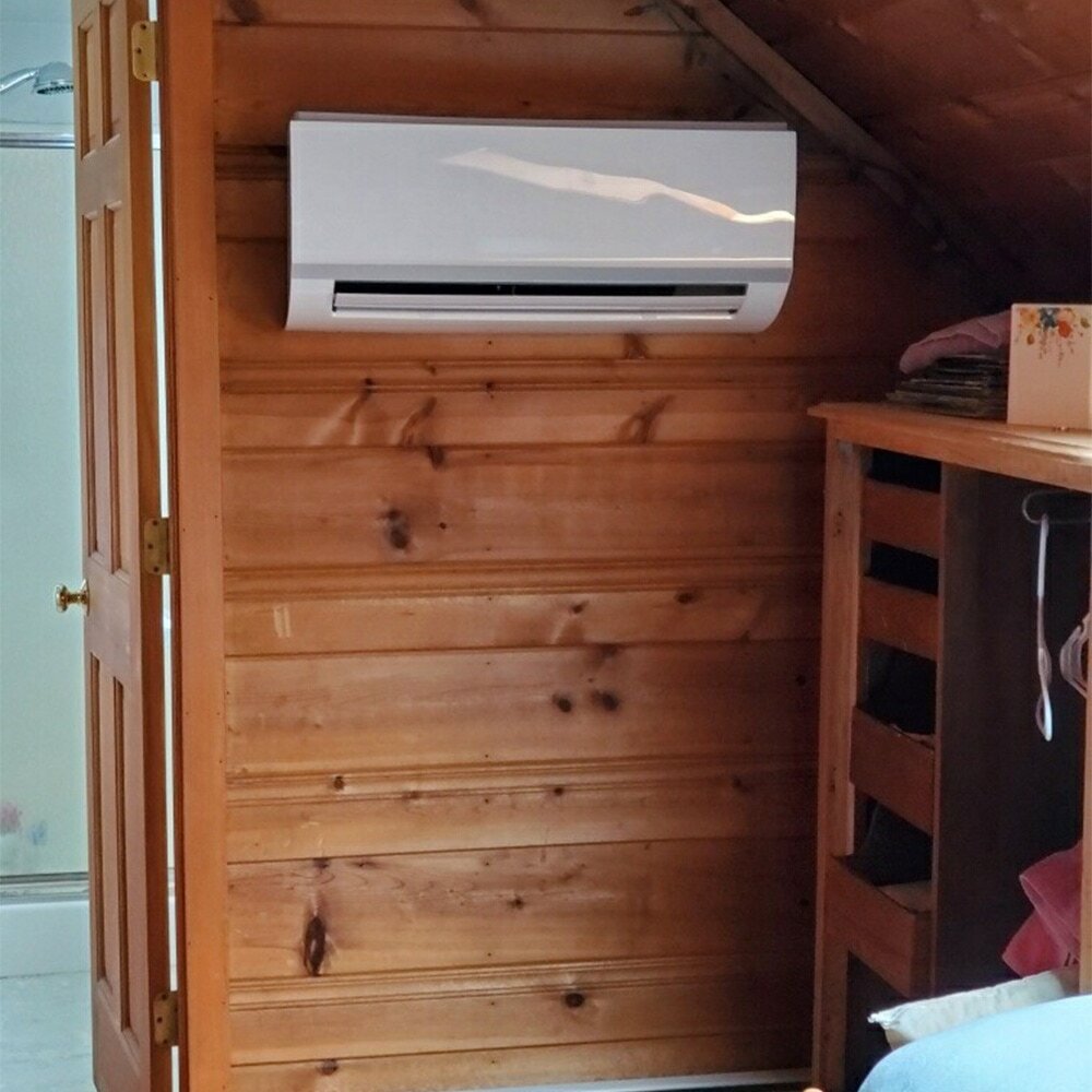 Sleek mini-split unit on a wood wall